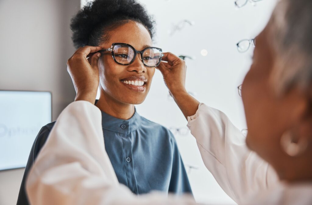 A person having their eyeglasses fitted to them to help ensure clear vision.