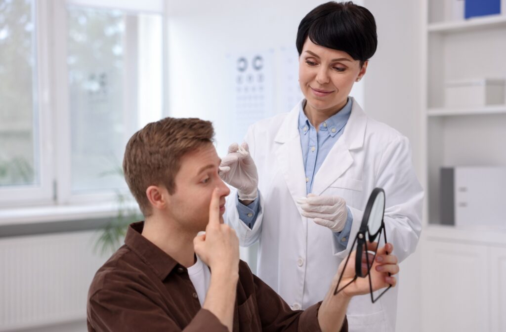 A person at the eye doctor having a contact lens exam and fitting.